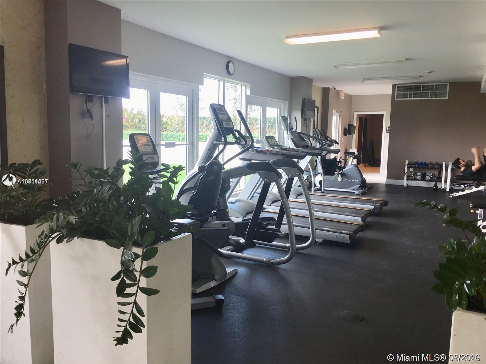 3000 Coral Way, Unit 1207 Miami, FL 33145 - Photo 5 of 8 a view of a room with gym equipment