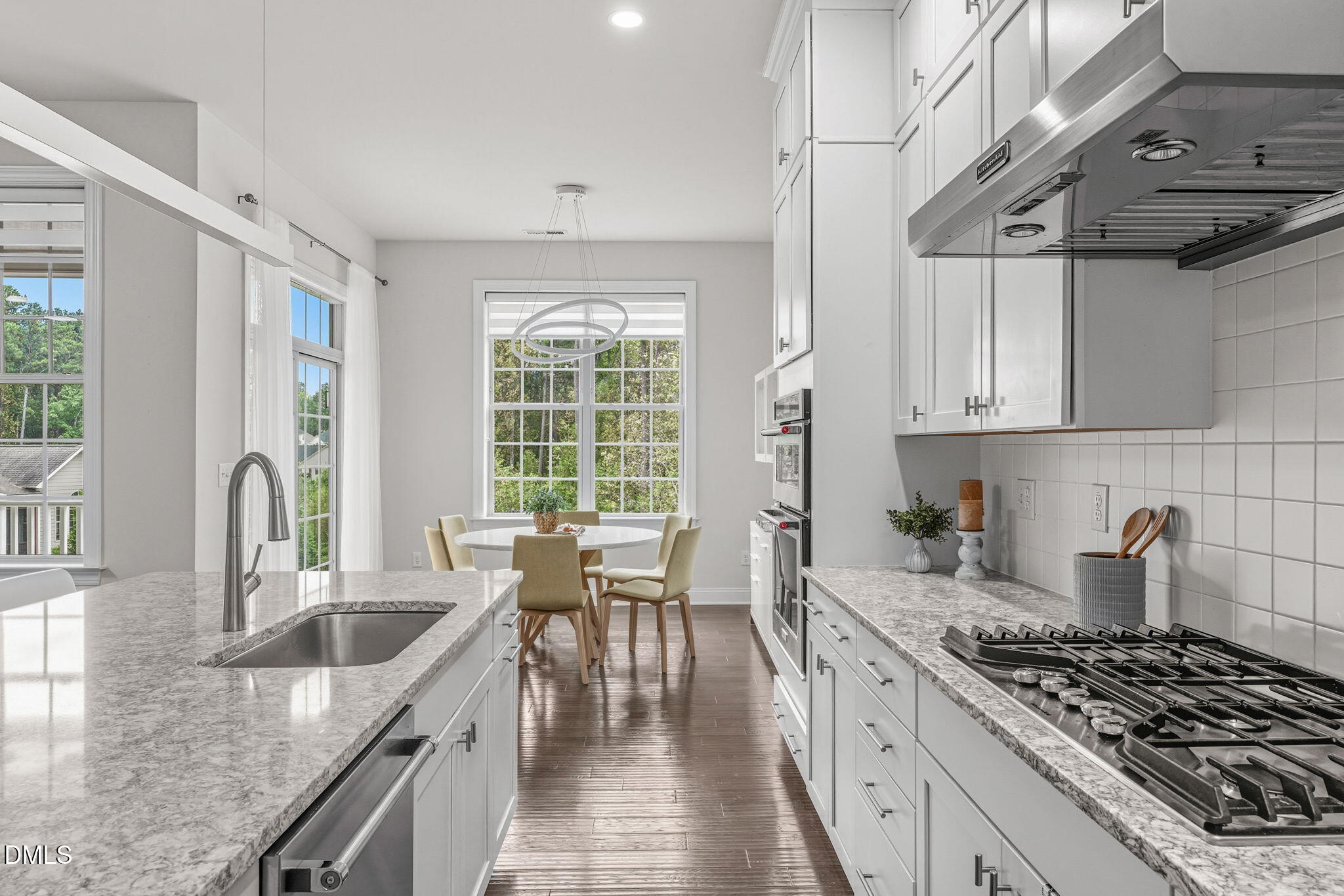 2613 Beckwith Road Apex, NC 27523 - Photo 16 of 73 a kitchen with stainless steel appliances granite countertop a sink stove and cabinets