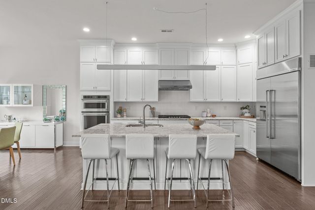a view of an empty room and wooden floor