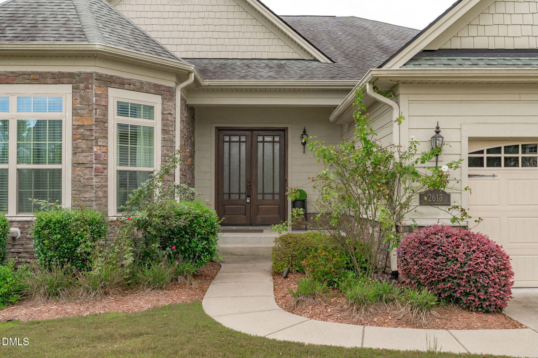 2613 Beckwith Road Apex, NC 27523 - Photo 2 of 73 a front view of a house with garden