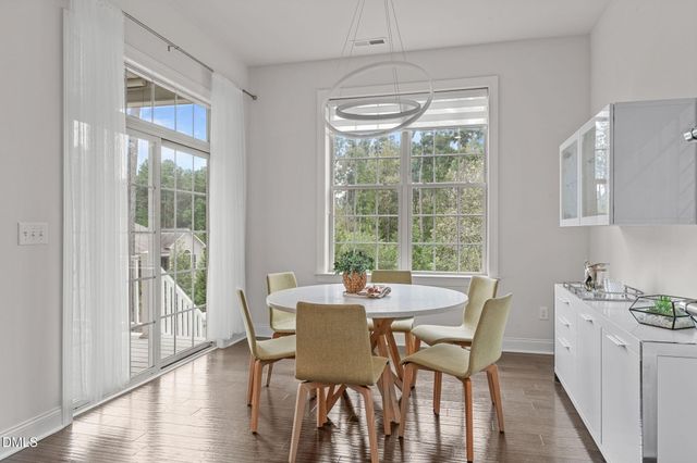 a living room with a garden and a flat screen tv