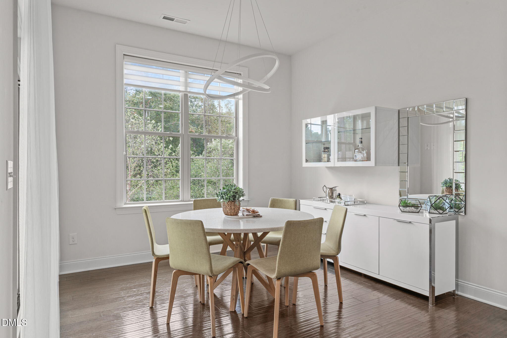 2613 Beckwith Road Apex, NC 27523 - Photo 22 of 73 a view of a dining room with furniture and wooden floor