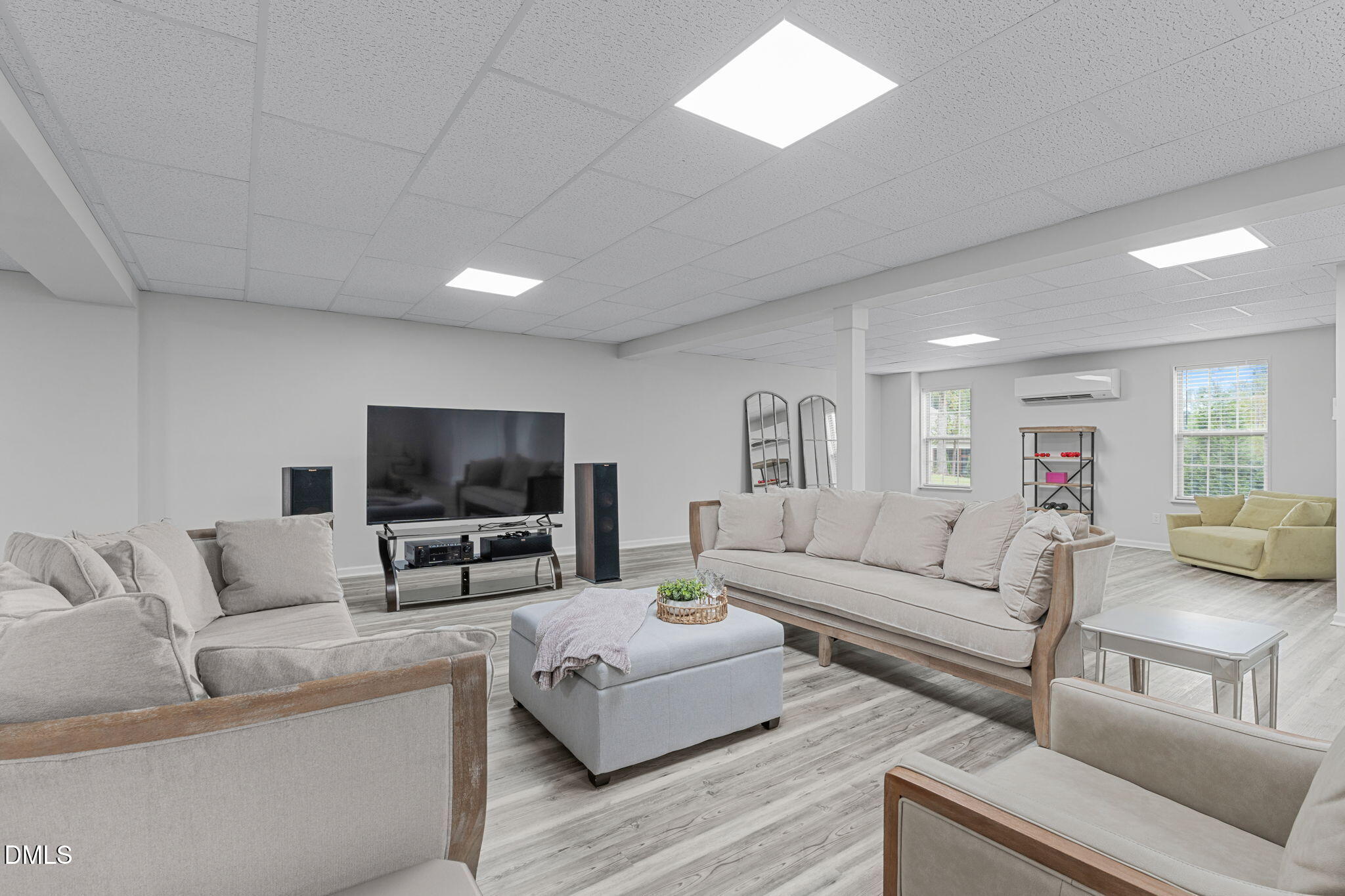 2613 Beckwith Road Apex, NC 27523 - Photo 39 of 73 a living room with furniture and a flat screen tv