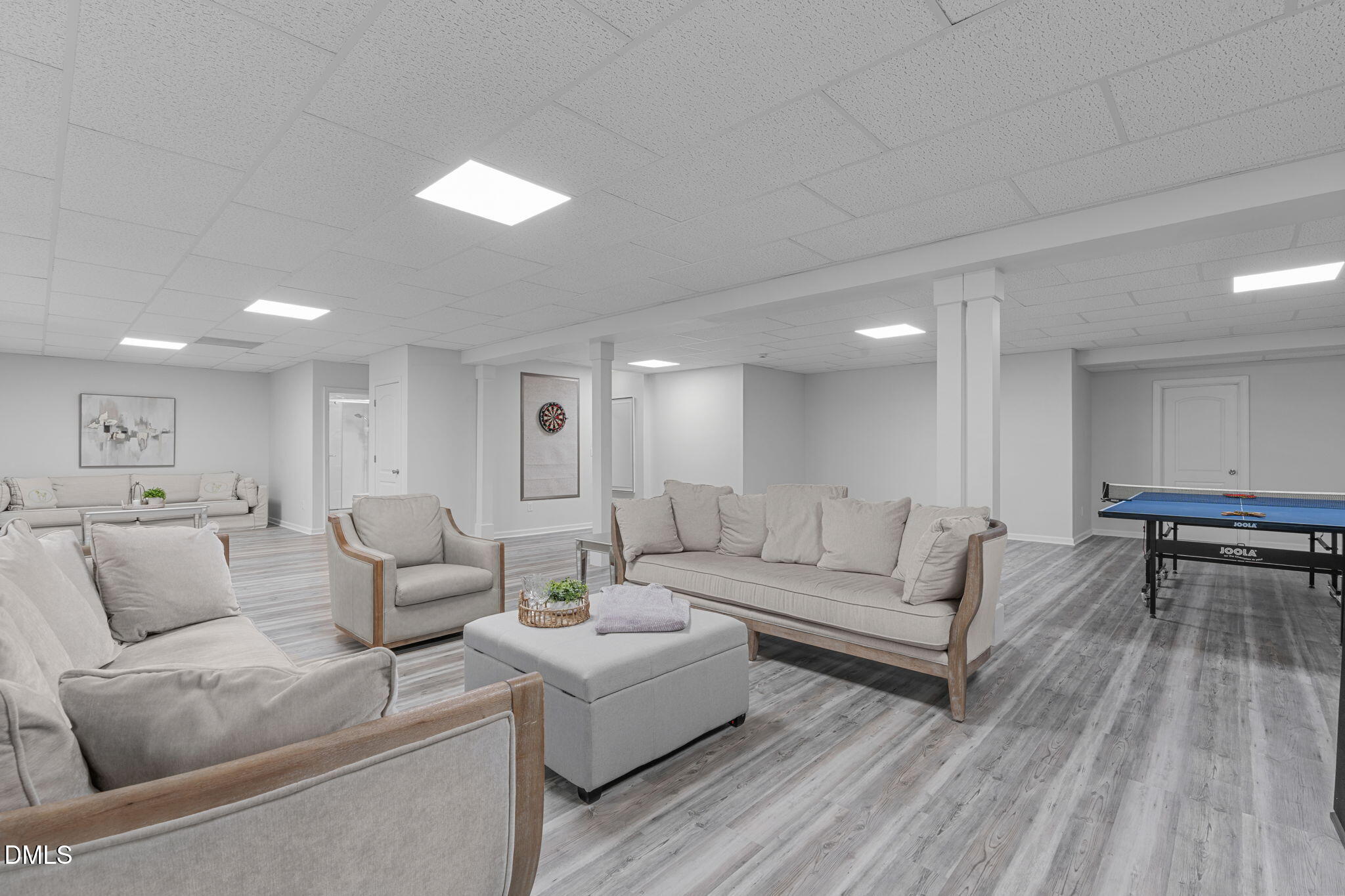 2613 Beckwith Road Apex, NC 27523 - Photo 40 of 73 a living room with furniture and a wooden floor