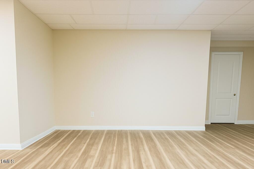 2613 Beckwith Road Apex, NC 27523 - Photo 43 of 73 a view of an empty room and wooden floor
