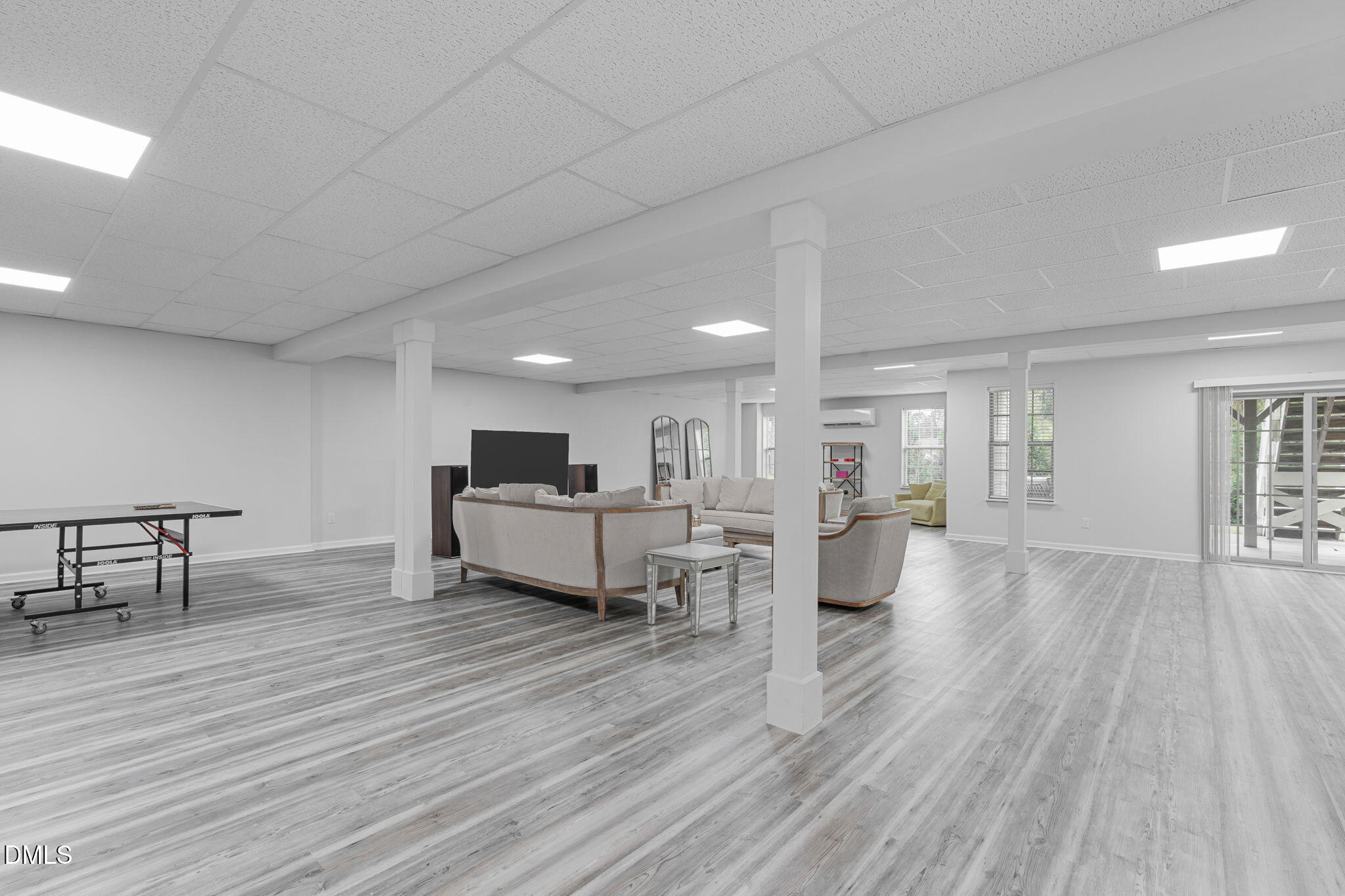 2613 Beckwith Road Apex, NC 27523 - Photo 45 of 73 a living room with furniture and a wooden floor