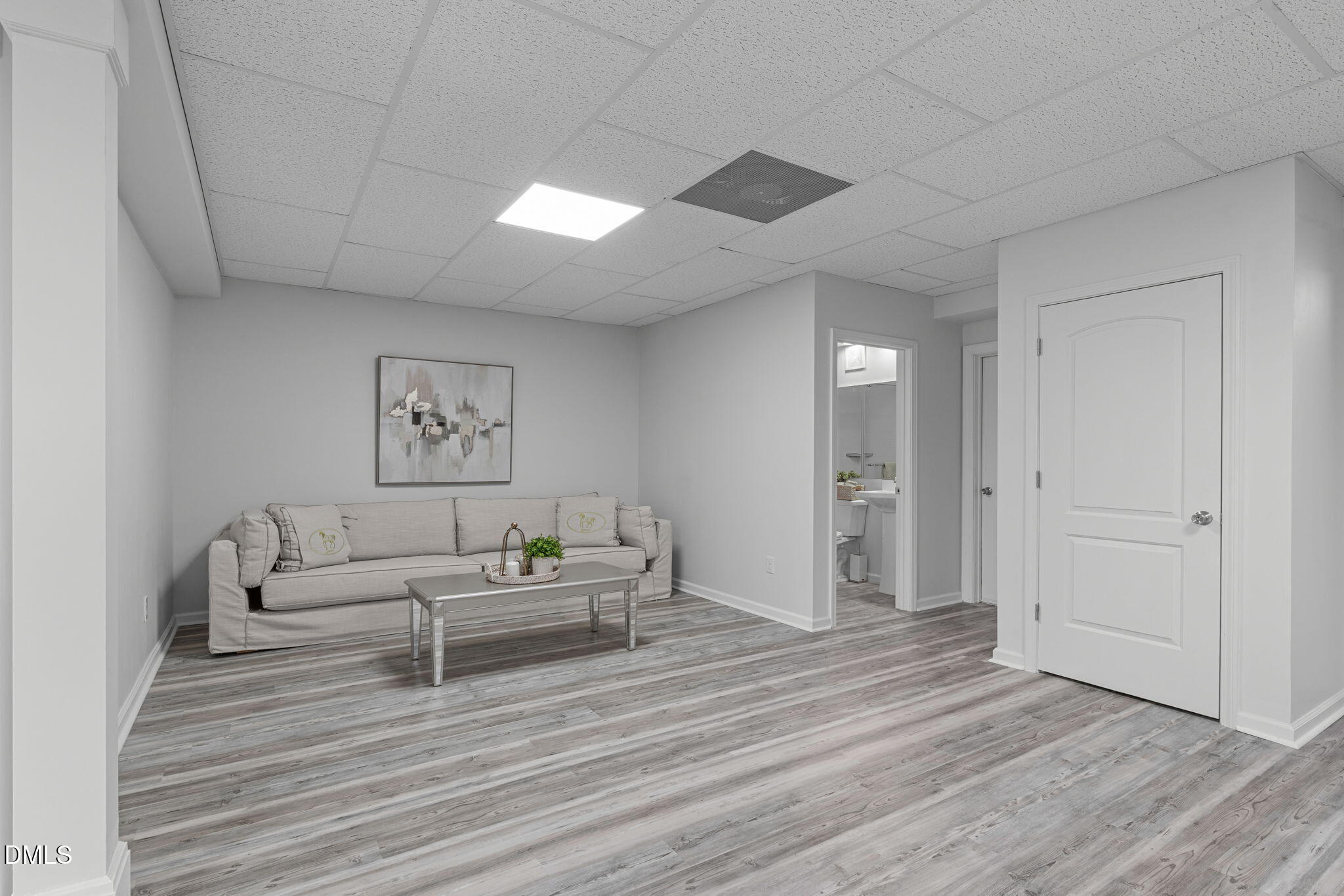 2613 Beckwith Road Apex, NC 27523 - Photo 48 of 73 a living room with furniture and a wooden floor