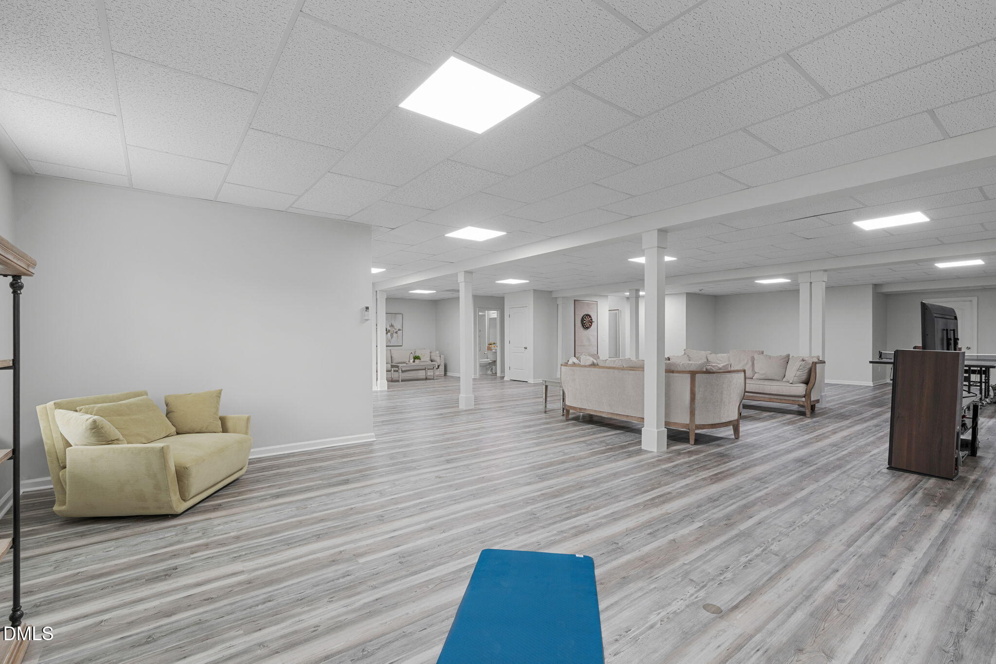 2613 Beckwith Road Apex, NC 27523 - Photo 51 of 73 a living room with furniture and a wooden floor