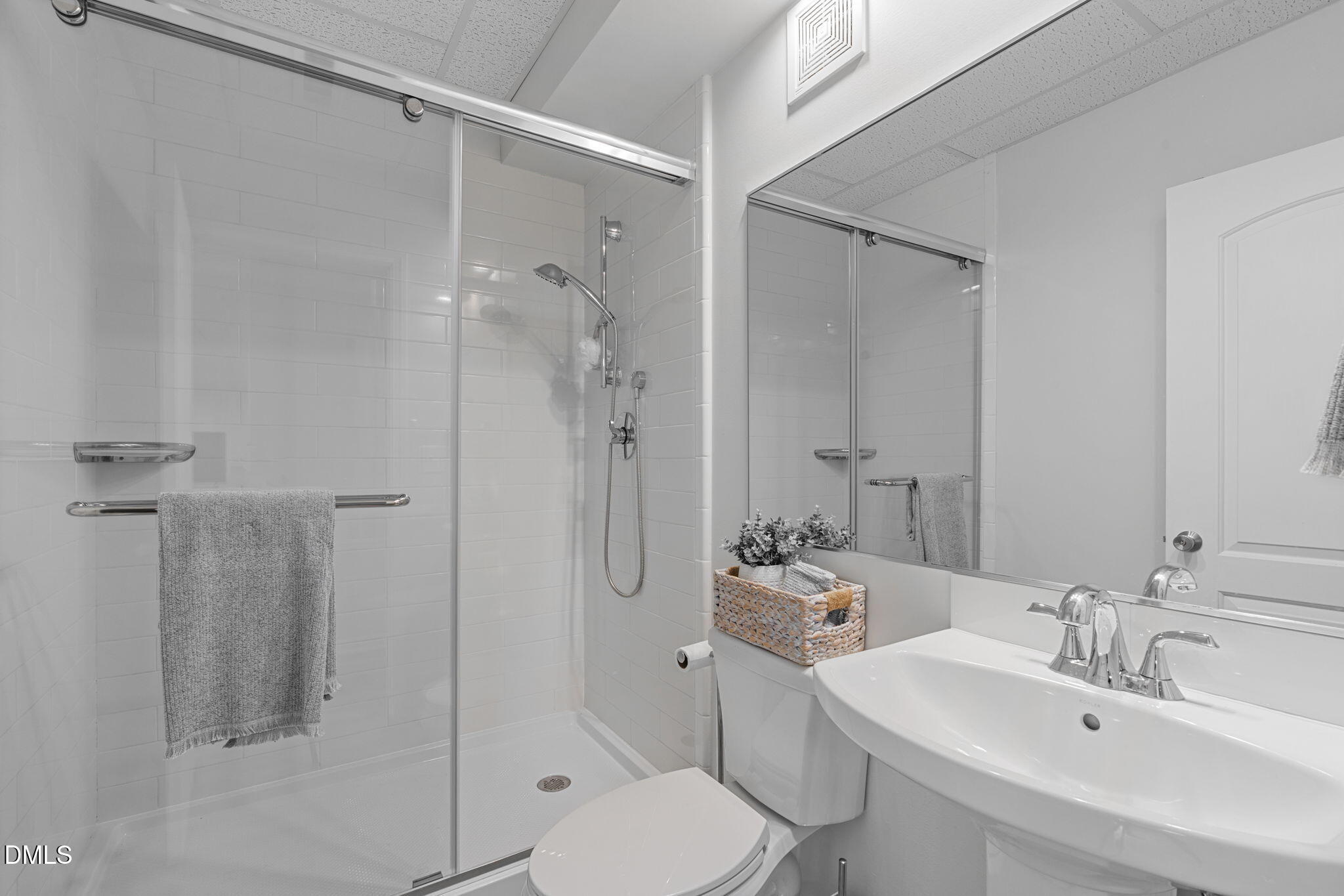 2613 Beckwith Road Apex, NC 27523 - Photo 53 of 73 a bathroom with a sink toilet and shower