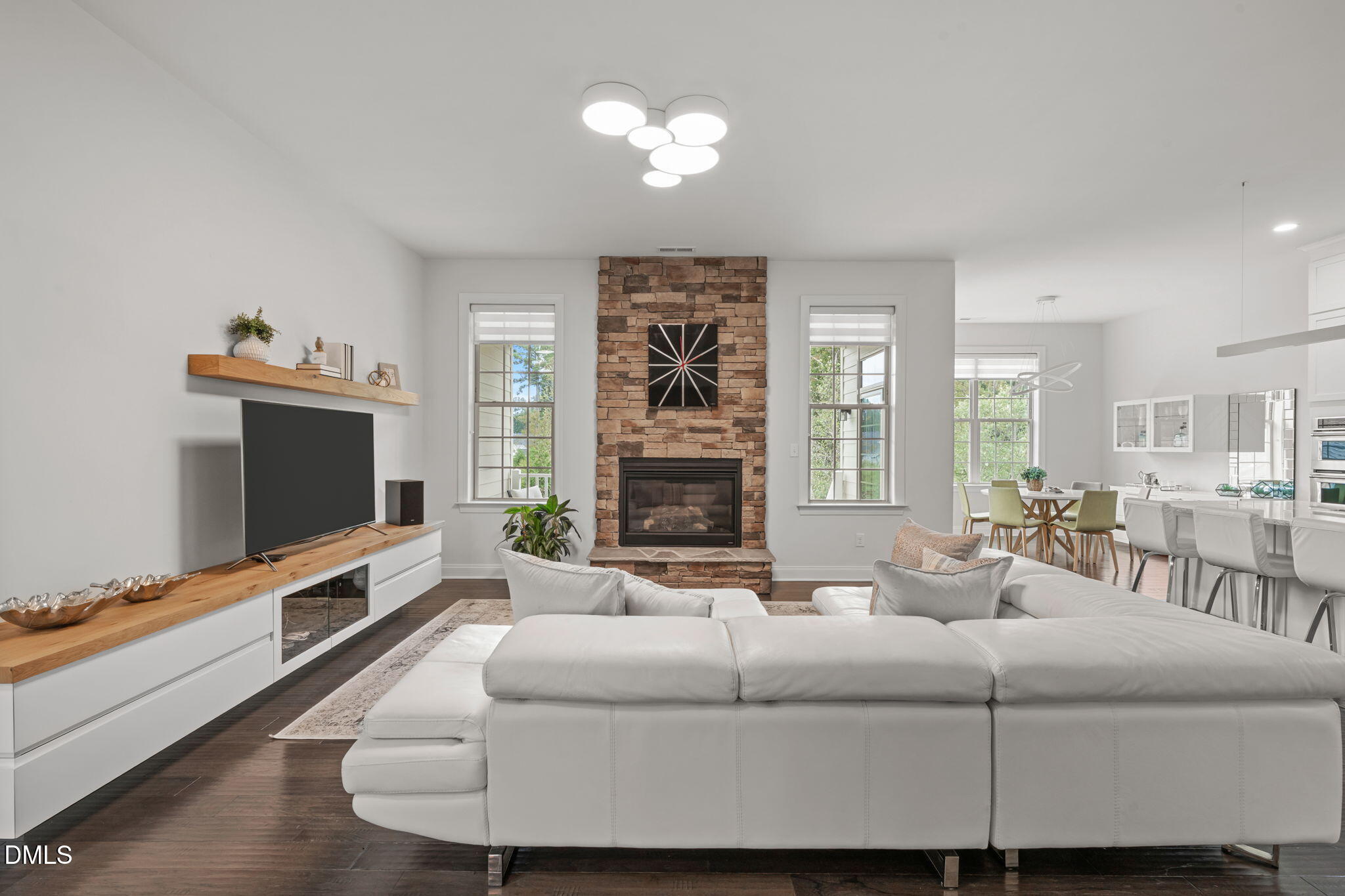 2613 Beckwith Road Apex, NC 27523 - Photo 8 of 73 a living room with furniture and a flat screen tv