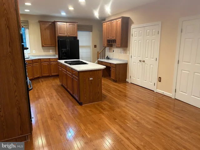 a large bathroom with a tub sink and mirror