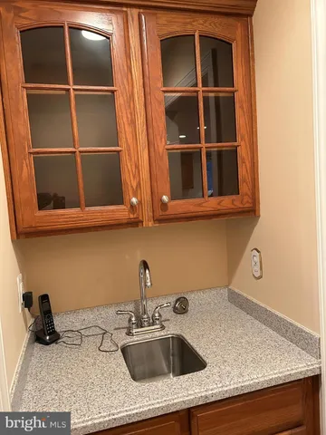 a kitchen with a sink and cabinets