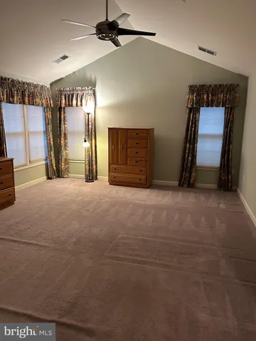 a view of an empty room with a fireplace