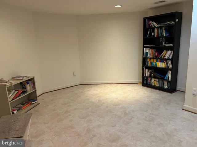 a room with furniture and white walls