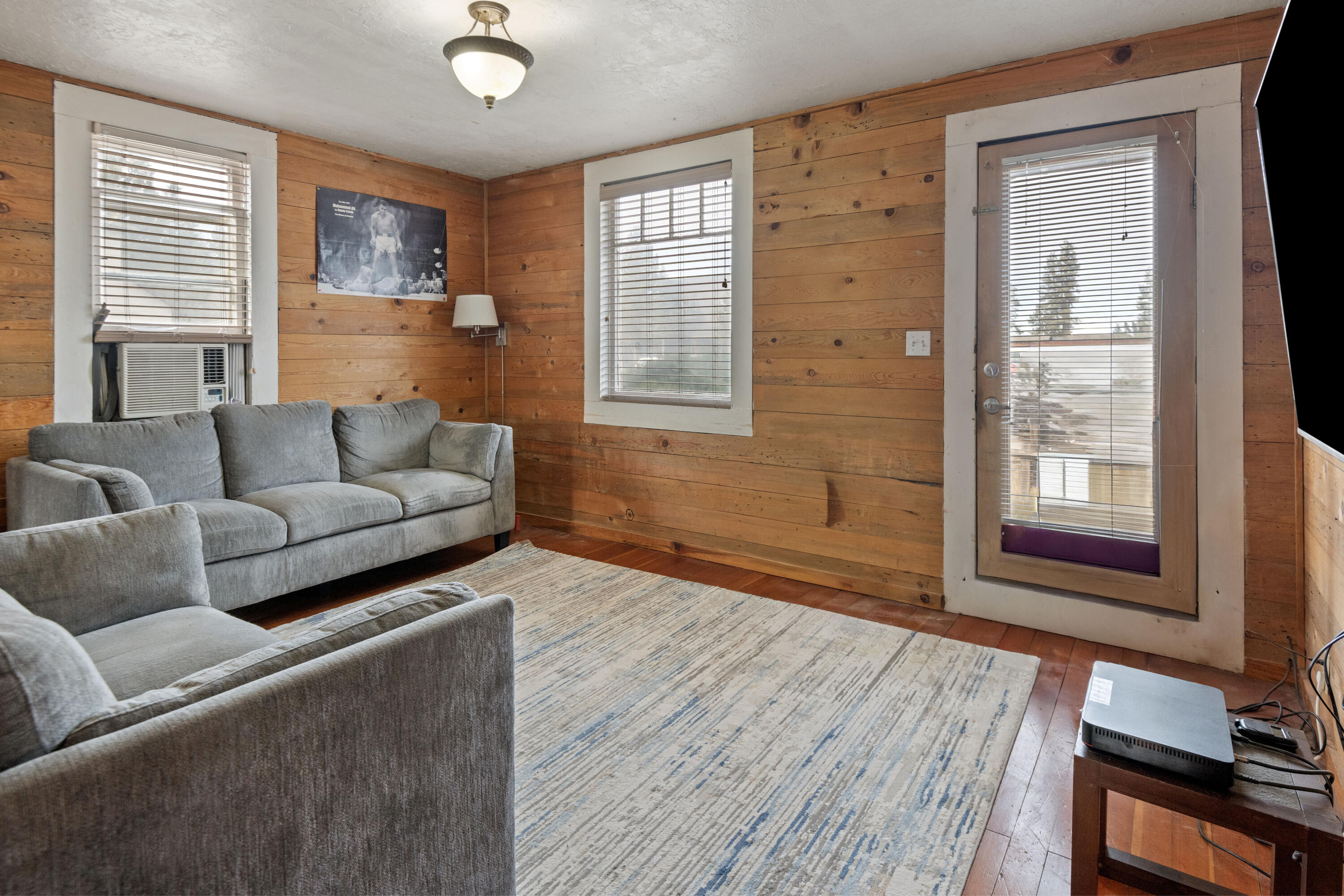 243 West Adams Avenue Sisters, OR 97759 - Photo 1 of 19 a living room with furniture and a window