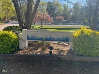 1014 Sandlin Place, Unit G Raleigh, NC 27606 - Photo 2 of 19 a view of a yard with large trees