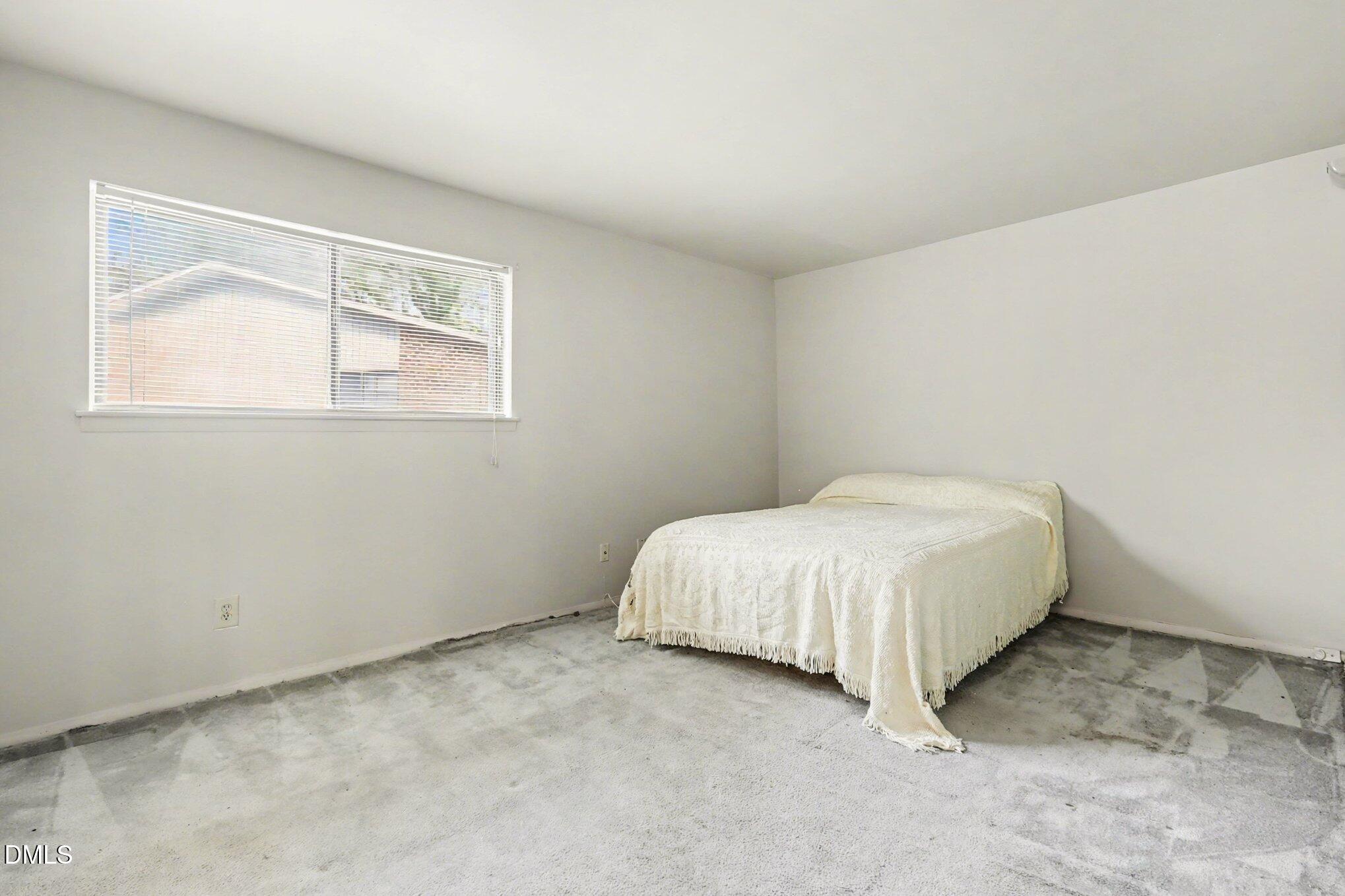 1014 Sandlin Place, Unit G Raleigh, NC 27606 - Photo 8 of 19 Primary Bedroom w/sitting area