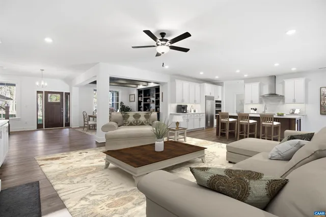 a view of an empty room with a fireplace and a window