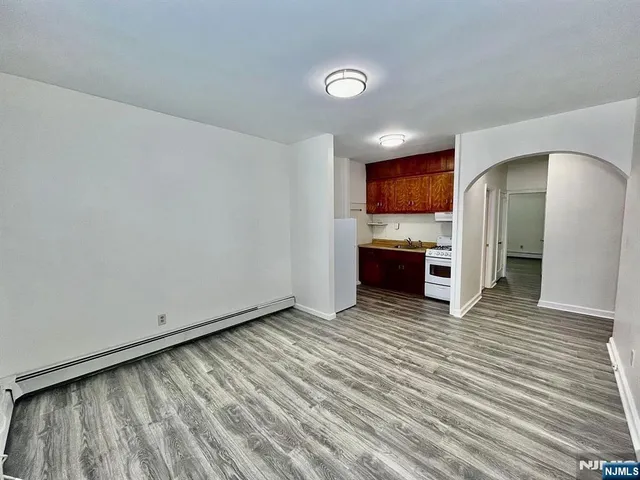 a view of kitchen with furniture and wooden floor