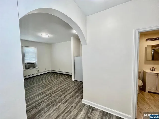 a view of a livingroom with wooden floor