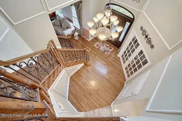 a bathroom with a granite countertop double vanity sink and a mirror