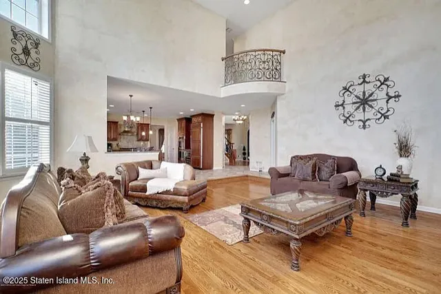 a bathroom with a granite countertop toilet a sink and a mirror