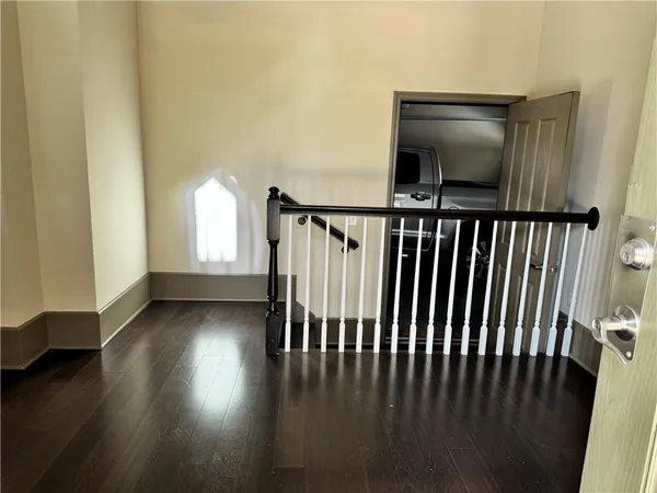 a view of entryway with wooden floor