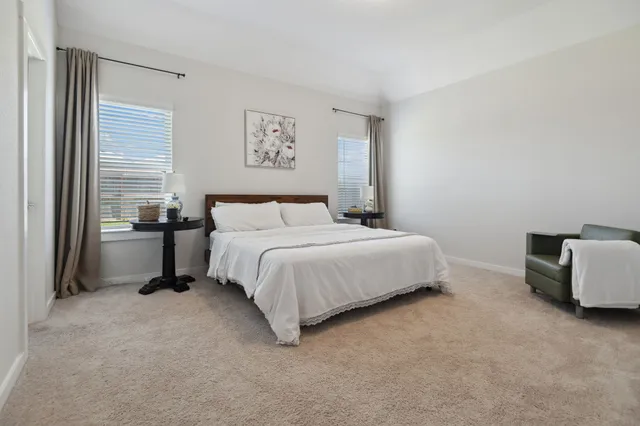 a bedroom with a bed and a cabinets