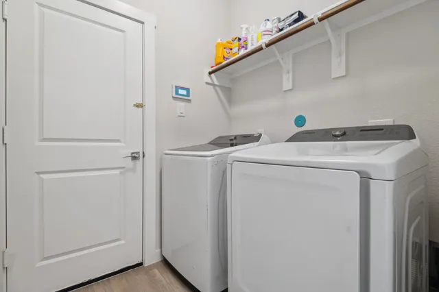 a utility room with dryer and washer