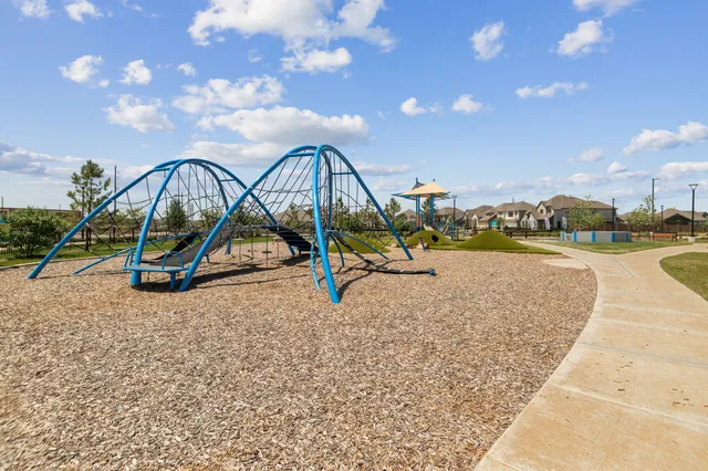 a view of a swimming pool with lounge chairs