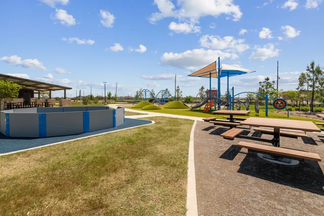a view of a swimming pool with an outdoor seating