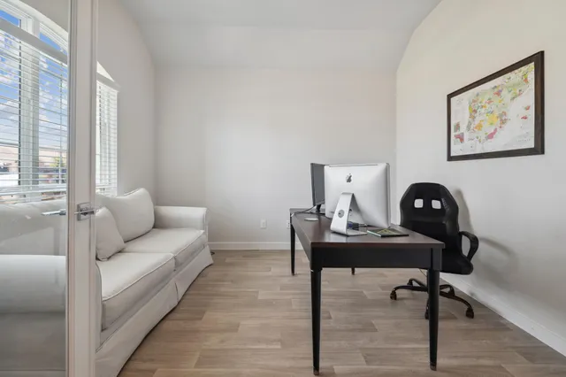 a living room with furniture and a window