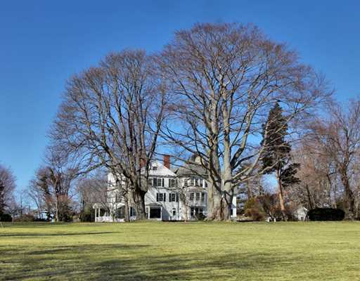 Undisclosed Address Darien, CT 06820 - Photo 3 of 9 a large green building with trees in the background