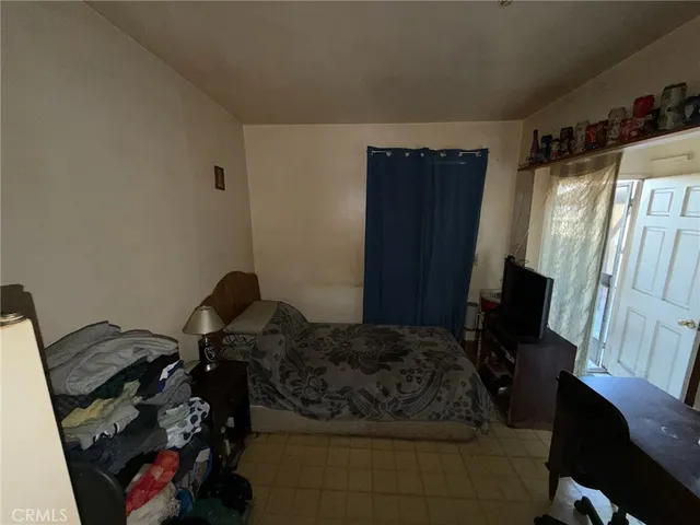 a bathroom with a granite countertop toilet and a shower