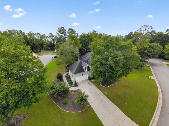 a view of a swimming pool with a yard