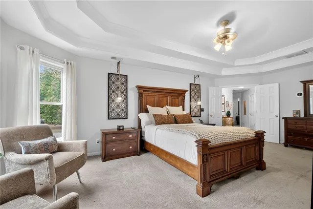 a bedroom with a bed and a couch