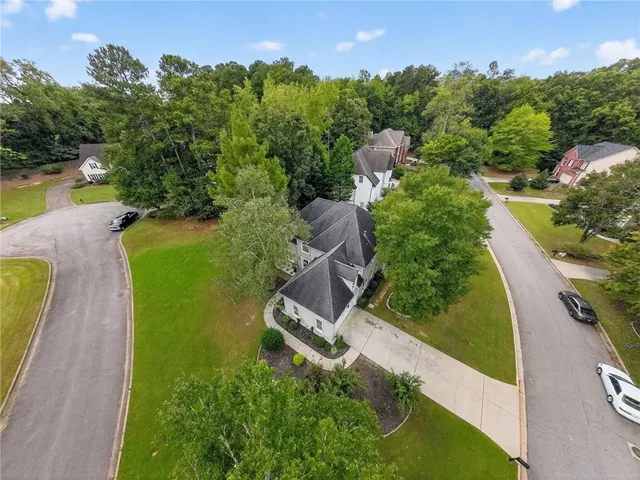 an aerial view of a house with yard swimming pool and outdoor seating