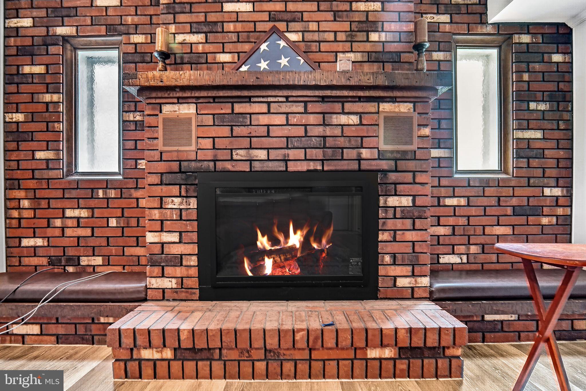 1305 Carlisle Road North Brunswick, NJ 08902 - Photo 25 of 32 Cozy brick fireplace