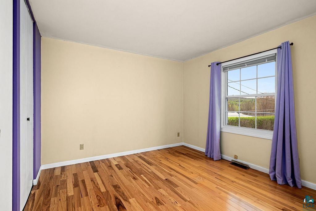 33 Nelson Drive Silver Bay, MN 55614 - Photo 17 of 40 Unfurnished room with light wood-style floors and baseboards