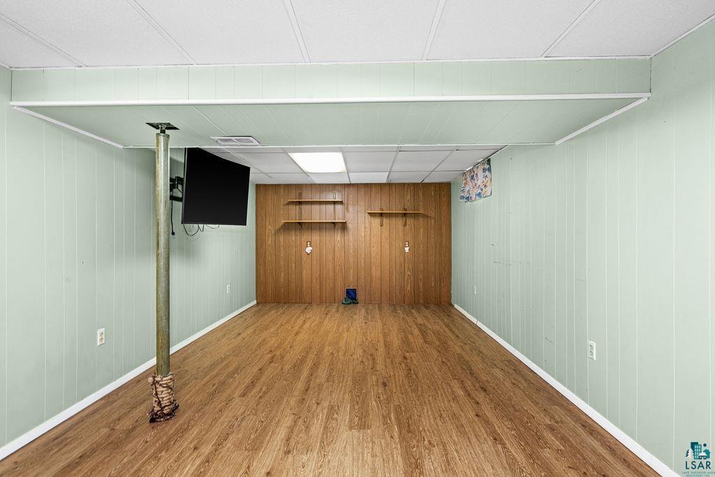 33 Nelson Drive Silver Bay, MN 55614 - Photo 25 of 40 Finished below grade area featuring wood finished floors, baseboards, and wooden walls