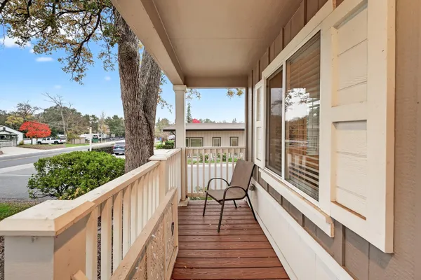 a view of balcony with wooden floor and outdoor space