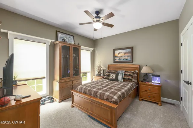 an aerial view of a house with a lake view