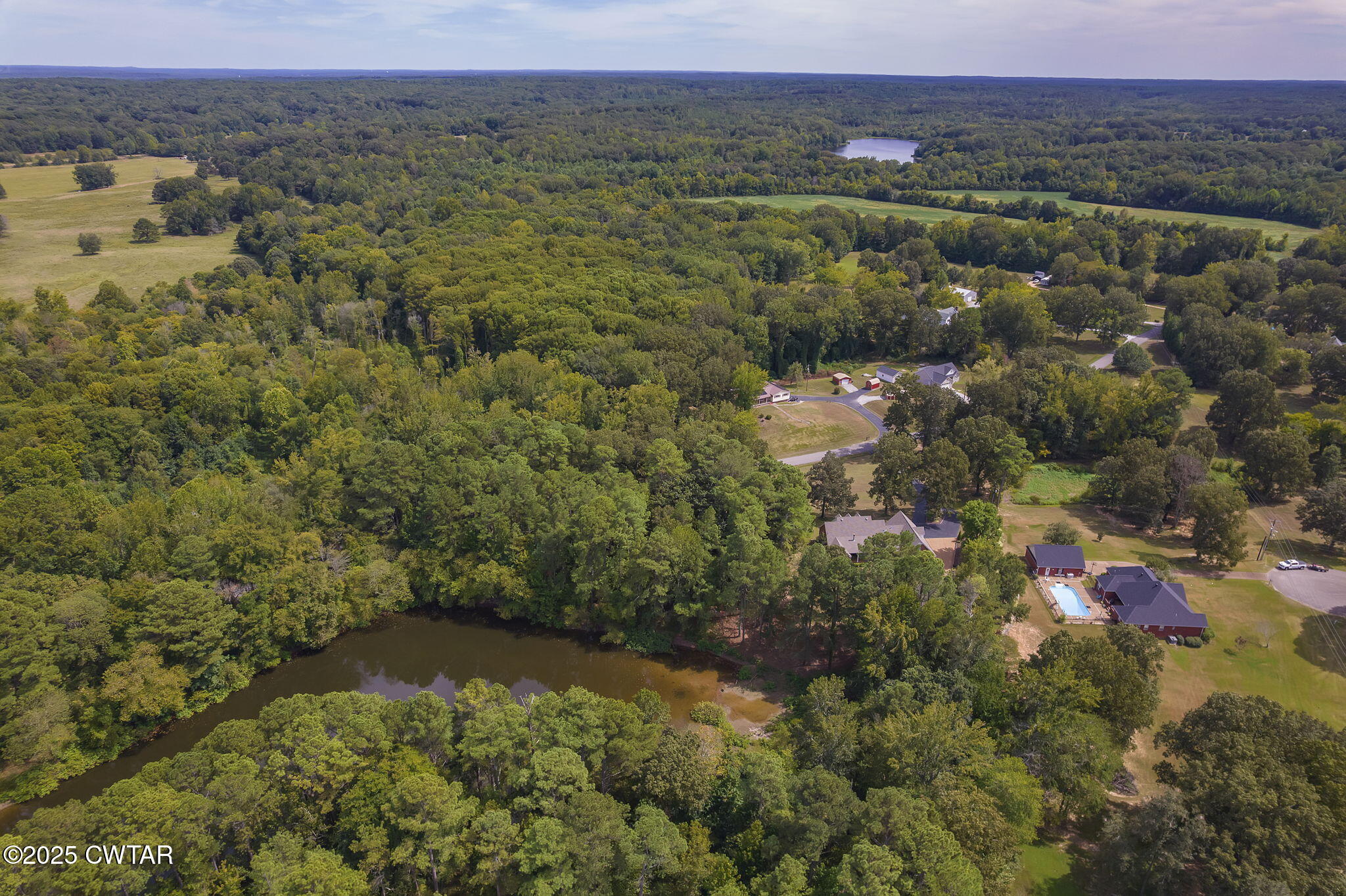 180 Medon Malesus Road Medon, TN 38356 - Photo 40 of 73 an aerial view of residential house with outdoor space and trees all around