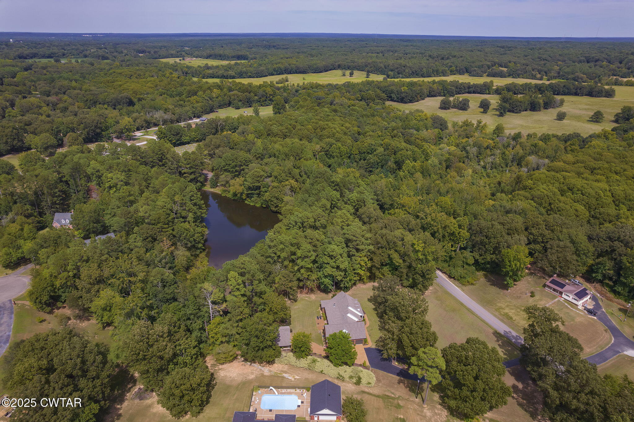 180 Medon Malesus Road Medon, TN 38356 - Photo 43 of 73 an aerial view of a house with a lake view