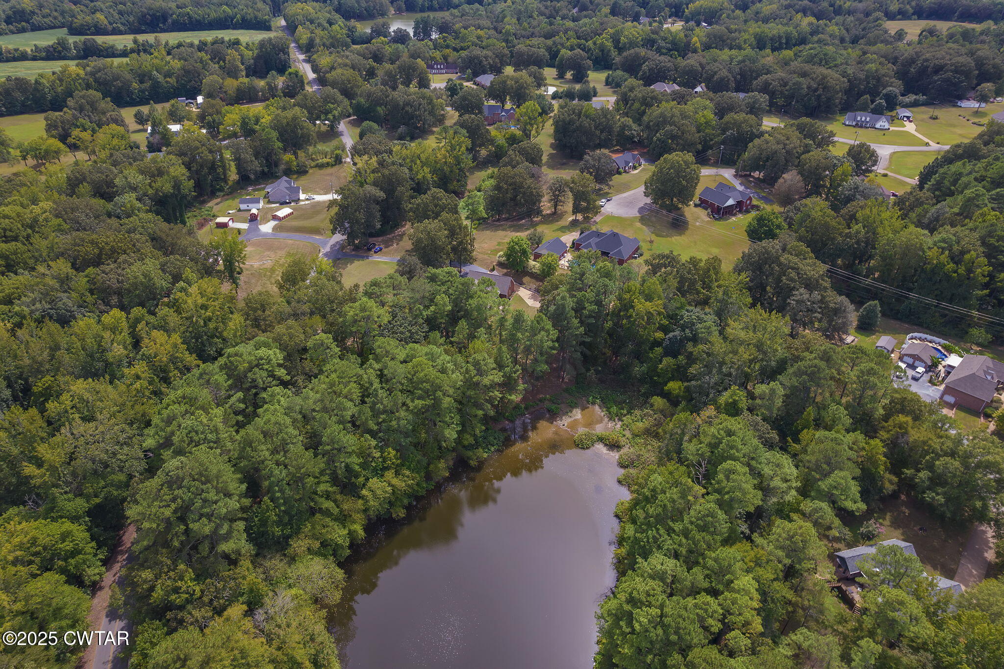 180 Medon Malesus Road Medon, TN 38356 - Photo 46 of 73 an aerial view of residential houses with outdoor space and trees
