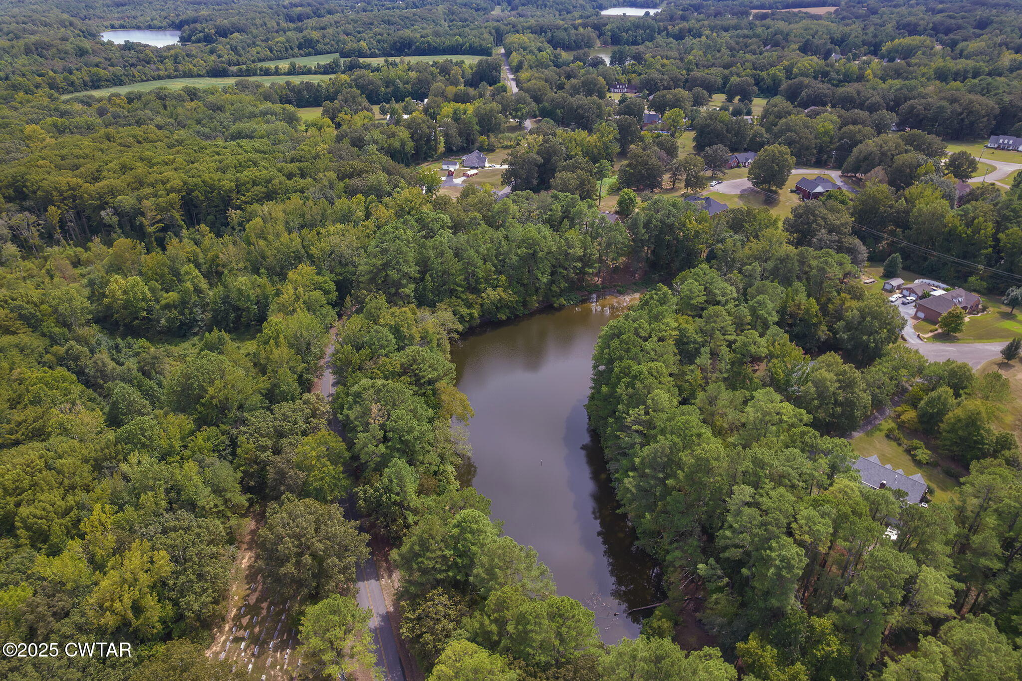 180 Medon Malesus Road Medon, TN 38356 - Photo 48 of 73 an aerial view of residential houses with outdoor space and trees