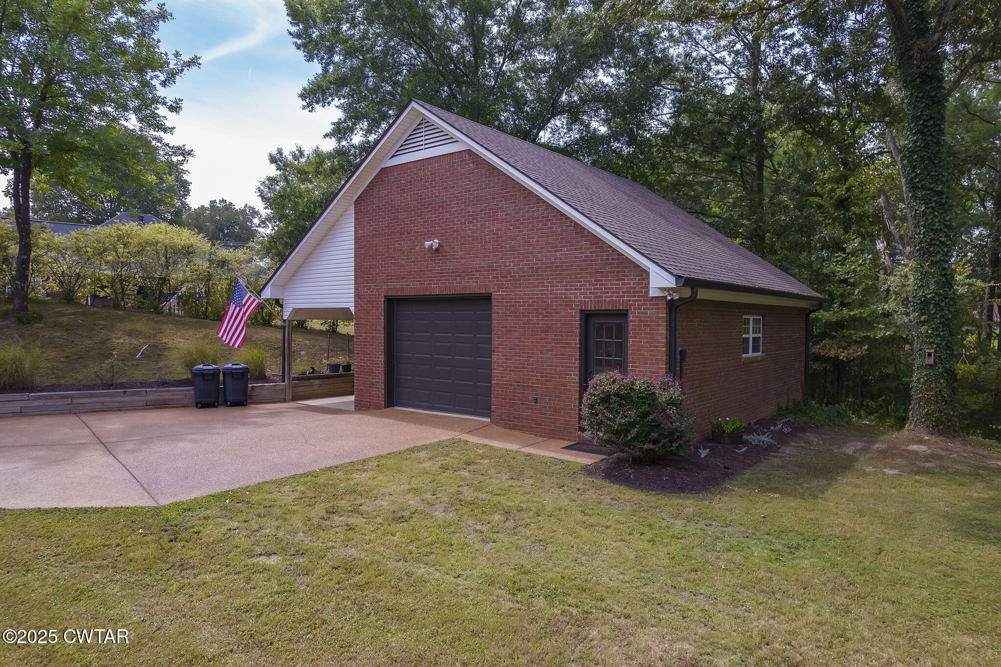 180 Medon Malesus Road Medon, TN 38356 - Photo 49 of 73 a front view of a house with a yard and garage