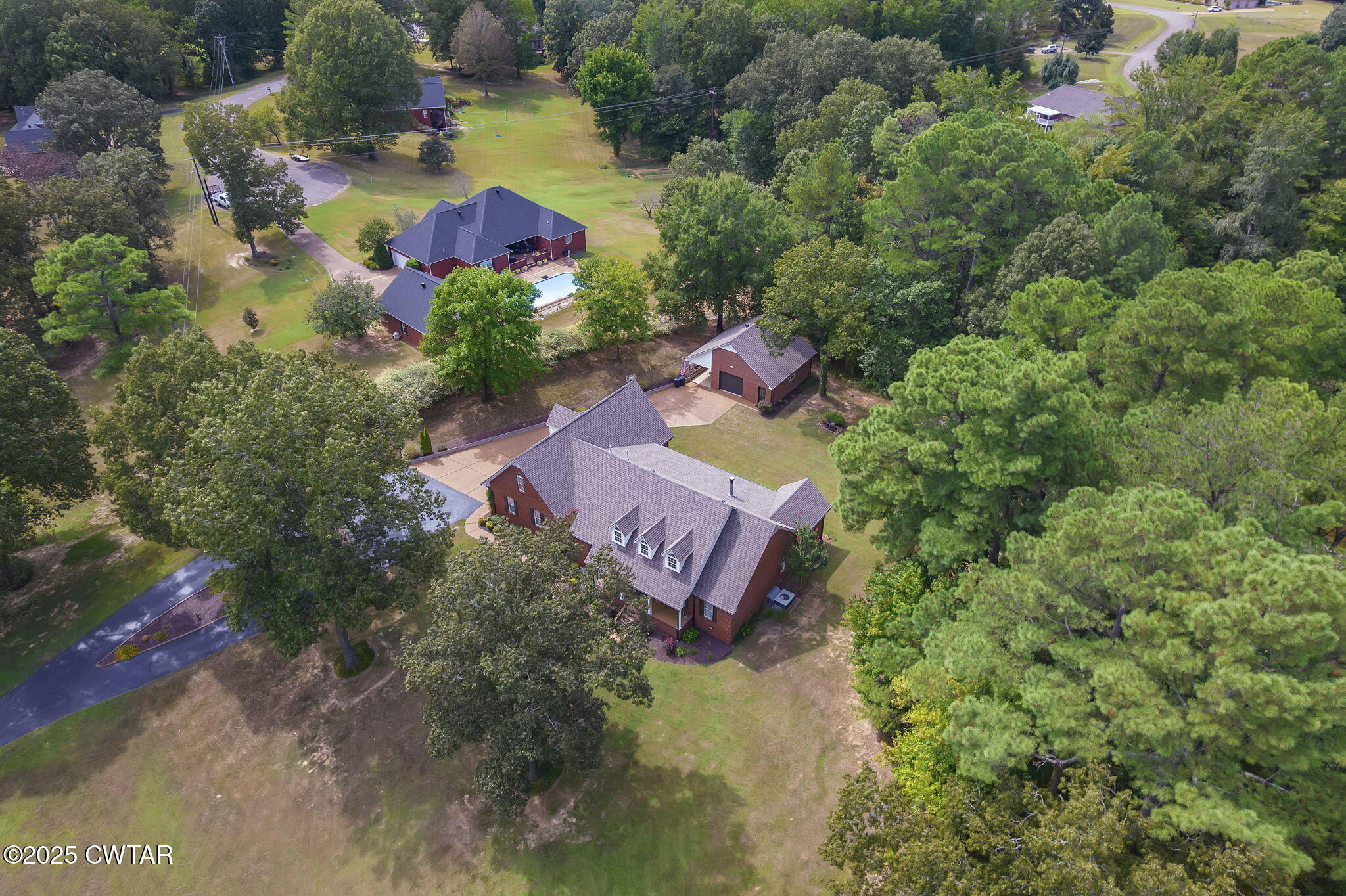 180 Medon Malesus Road Medon, TN 38356 - Photo 58 of 73 an aerial view of residential house with outdoor space and swimming pool