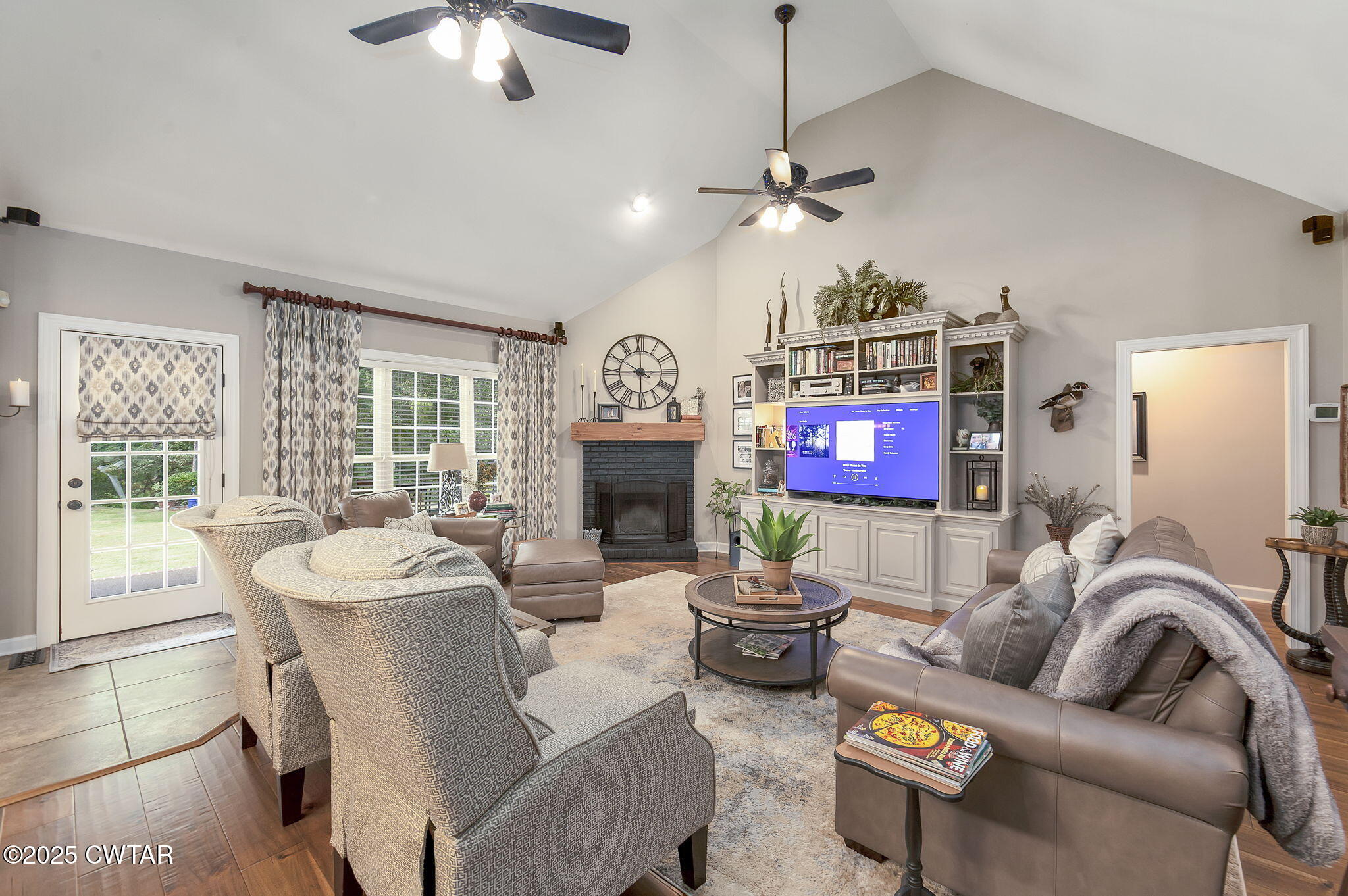 180 Medon Malesus Road Medon, TN 38356 - Photo 6 of 73 a living room with furniture a fireplace and a chandelier