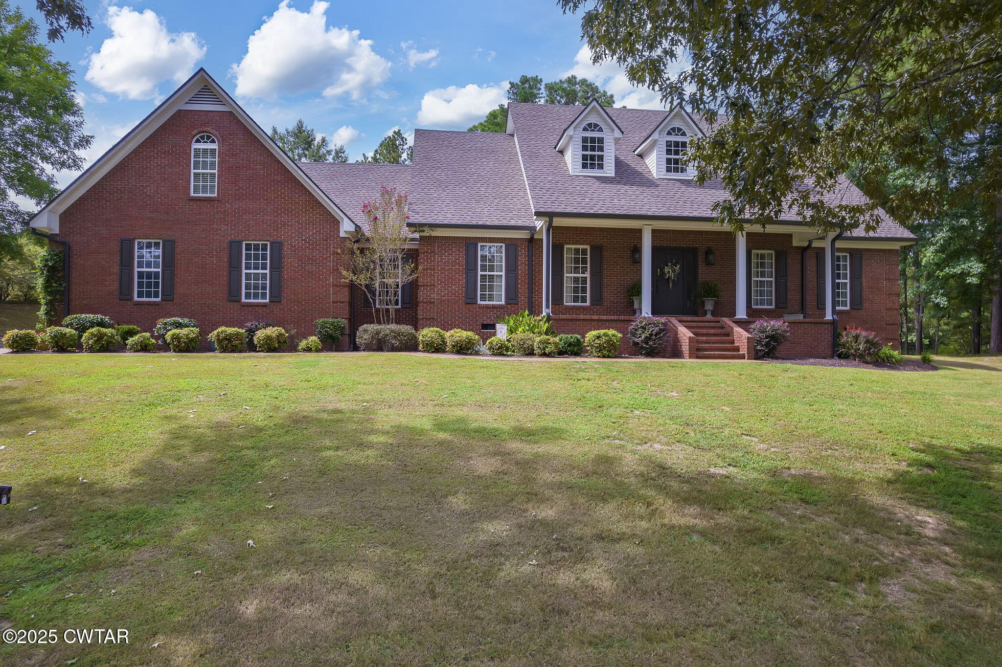 180 Medon Malesus Road Medon, TN 38356 - Photo 62 of 73 a front view of a house with a yard and garage